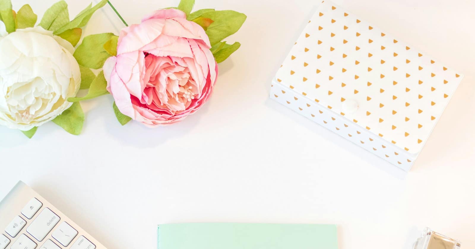 A notebook, calculator and money on a desk for budget planning