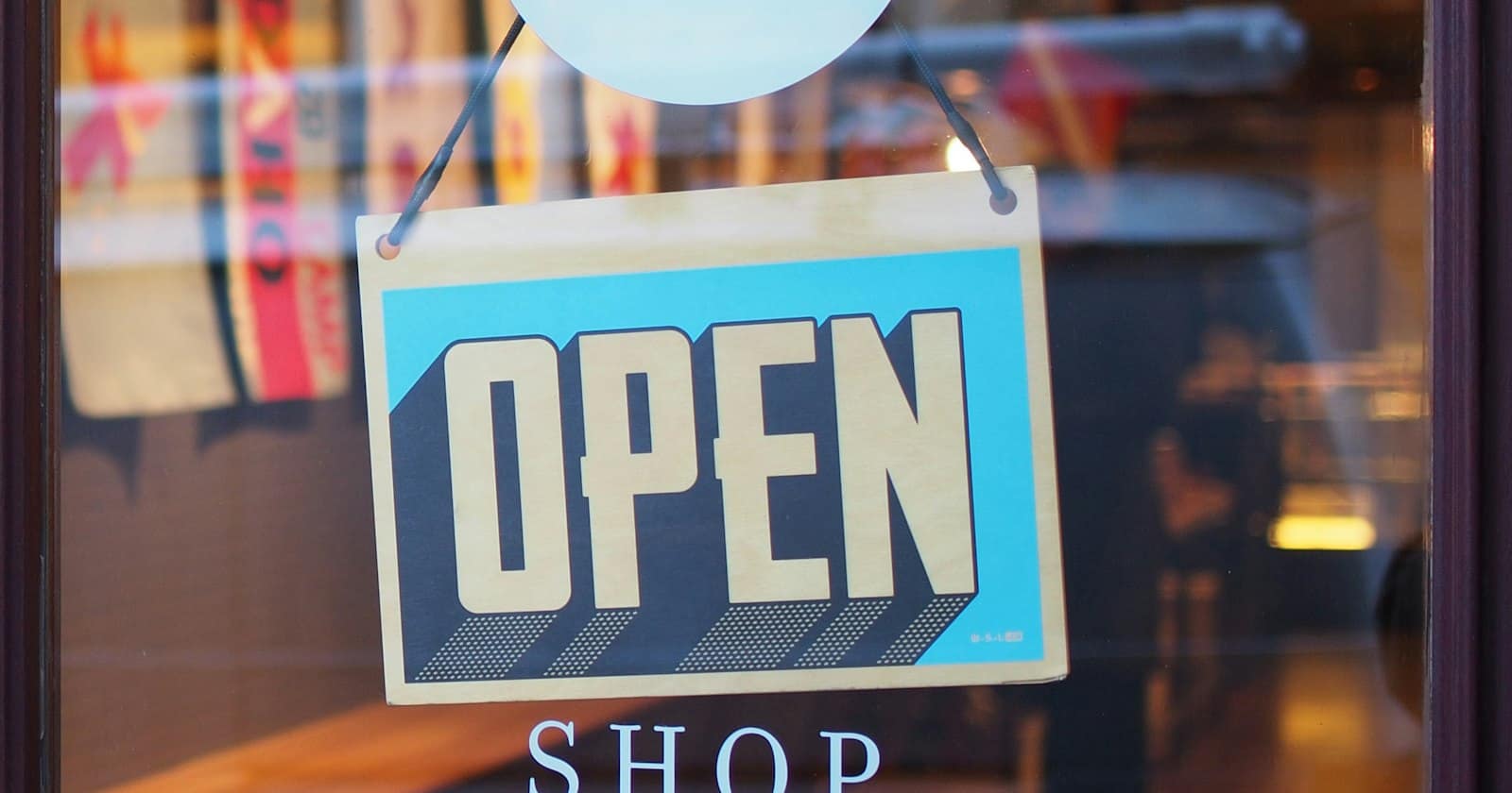An open shop door on a sunny street