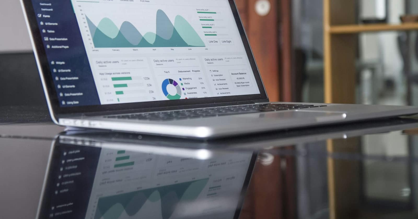 A laptop showing a spreadsheet of data