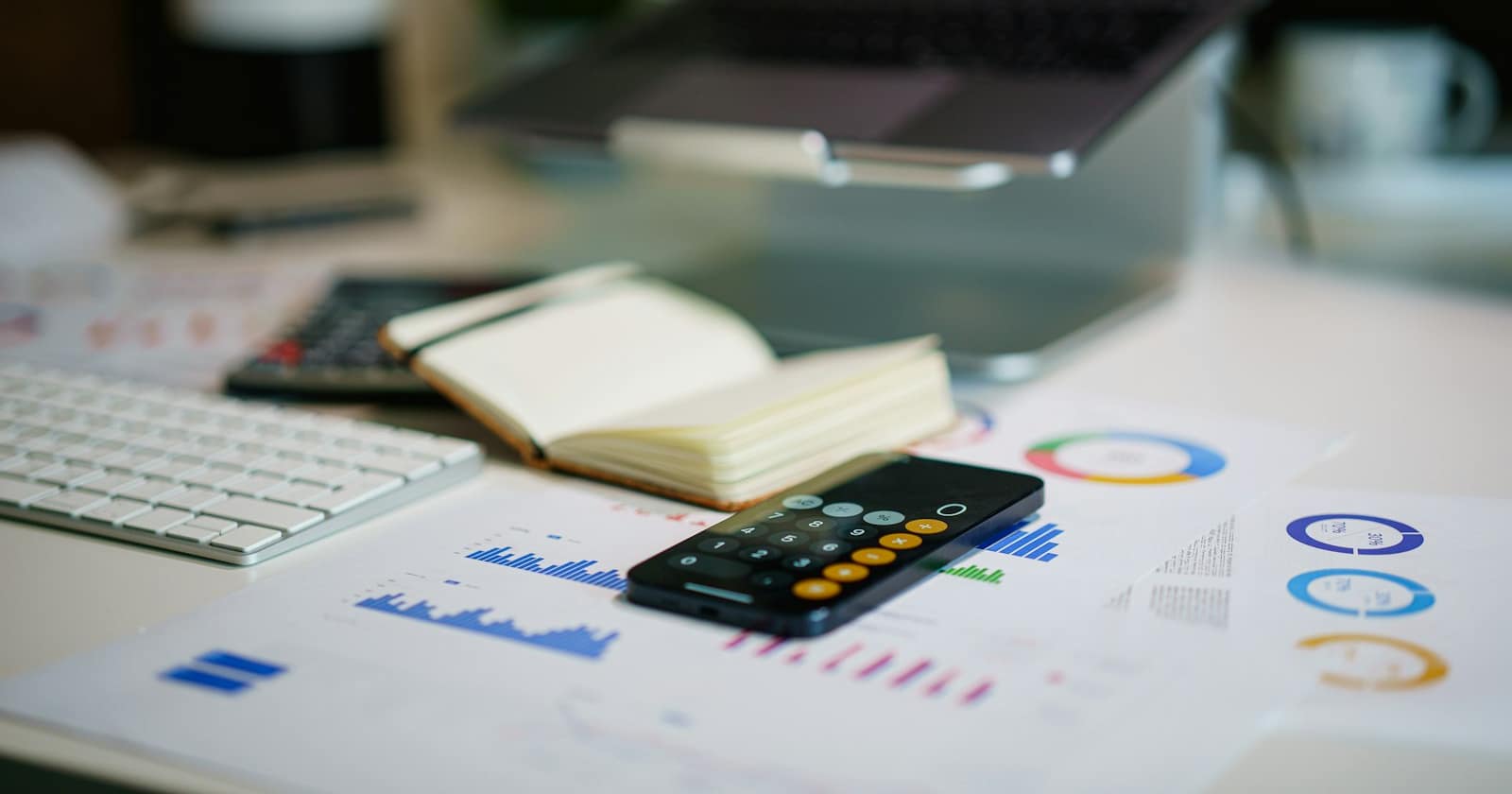 A spreadsheet of figures being reviewed on a desk