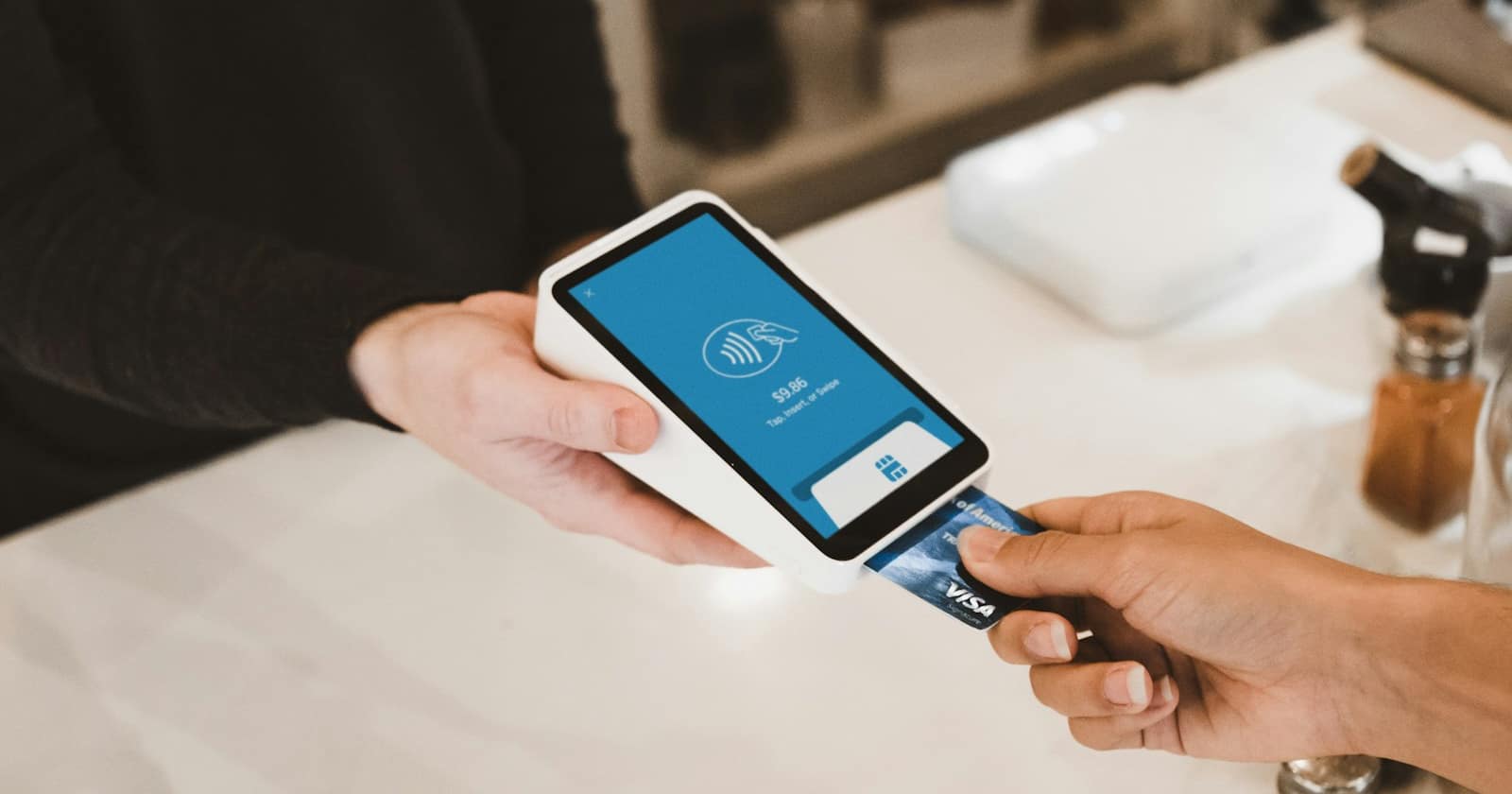 A card payment terminal on a shop counter