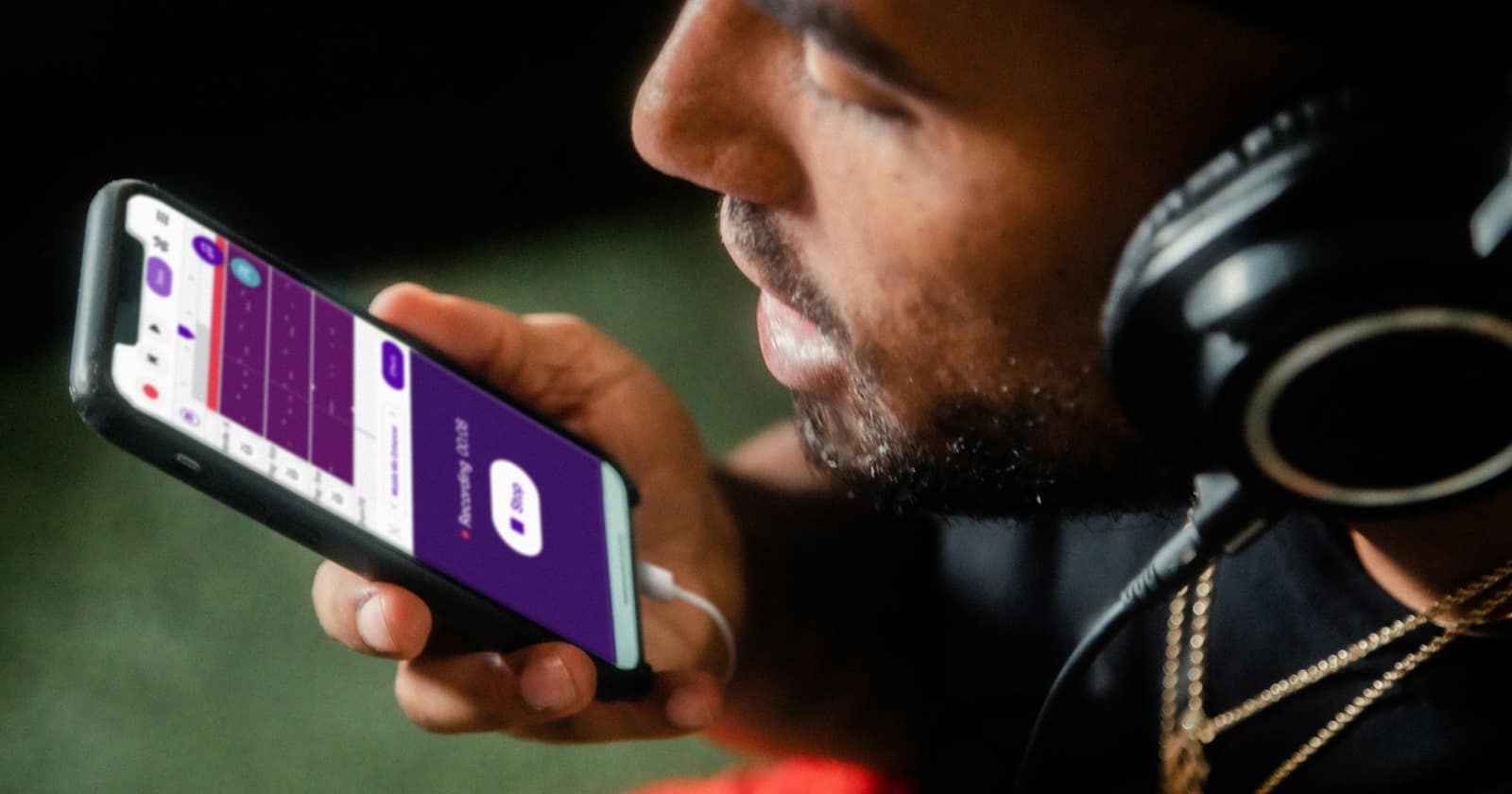 A person recording a voice message on a phone