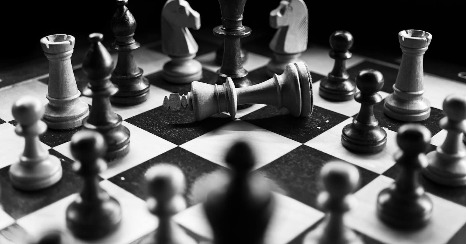 A chess board mid-game with pieces in play